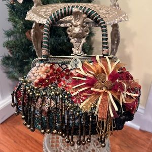 Beautiful Chico’s multicolored beaded crossbody/handbag, floral embellishments.